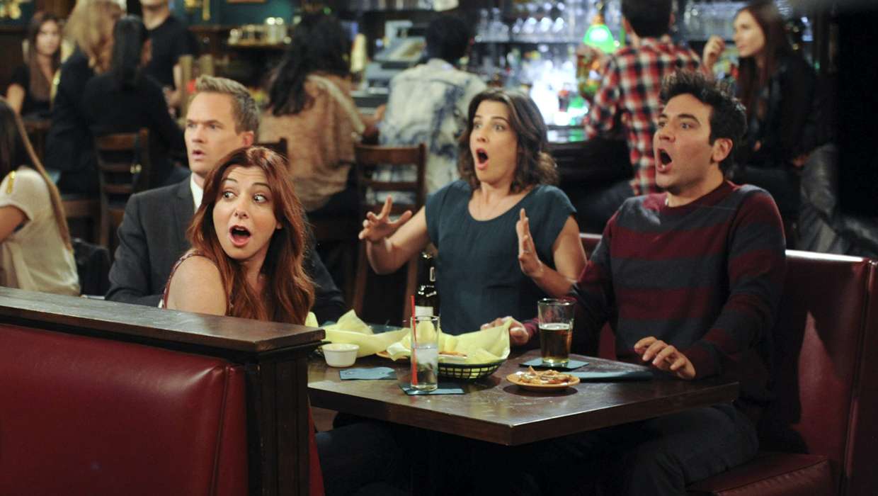 This image released by CBS shows, clockwise from foreground left, Alyson Hannigan, Neal Patrick Harris, Cobie Smulders and Josh Radnor in a scene from "How I Met Your Mother." Producers filmed the climactic scene of CBS' "How I Met Your Mother" finale eight years ago for fears that the actors involved would become unrecognizable, and have kept it under wraps ever since. The Monday night comedy concludes after nine seasons on March 31 with a one-hour episode. (AP Photo/CBS, Ron P. Jaffe)