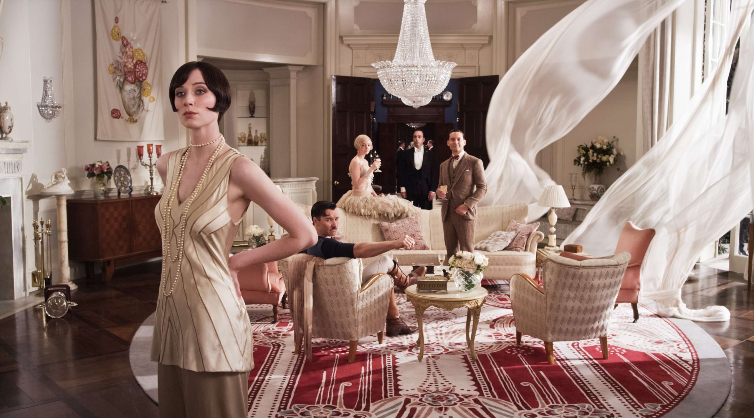 (L-r) ELIZABETH DEBICKI as Jordan Baker, JOEL EDGERTON as Tom Buchanan, CAREY MULLIGAN as Daisy Buchanan and TOBEY MAGUIRE as Nick Carraway in Warner Bros. Pictures’ and Village Roadshow Pictures’ drama “THE GREAT GATSBY,” a Warner Bros. Pictures release.