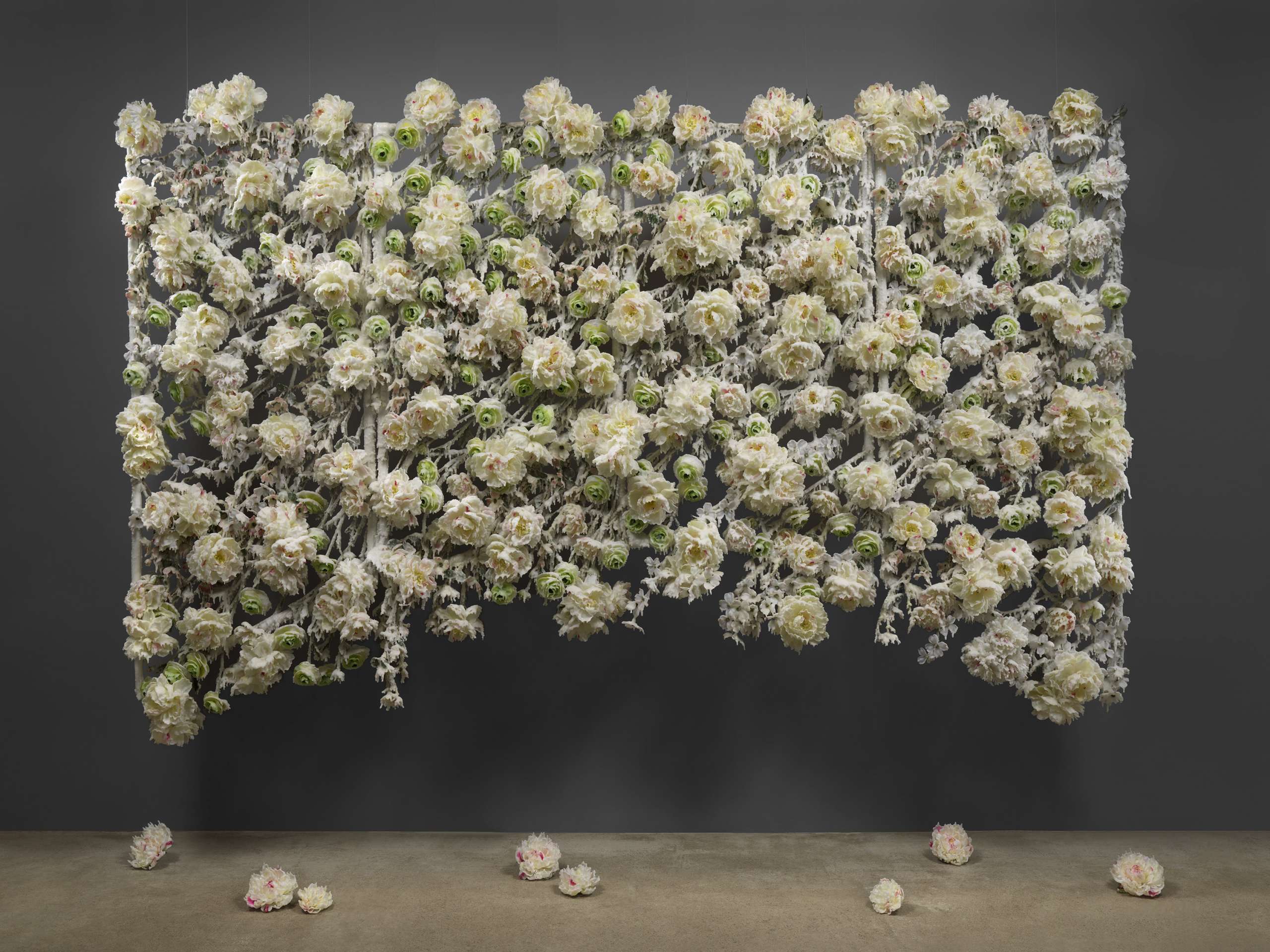 Petah Coyne, Untitled #1290 (Spring Snow), 2008-2020. Silk flowers, specially-formulated wax, pigment, fabricated steel understructure, cable, cable nuts, wire, Velcro, thread, quick-link shackles, jaw-to-jaw swivel. 200.7 x 304.8 x 35.6 cm. Courtesy of Petah Coyne Studio and Nunu Fine Art. Photo by Christopher Burke Studio.